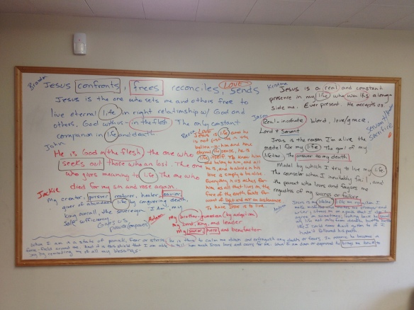 Whiteboard covered with text describing Jesus